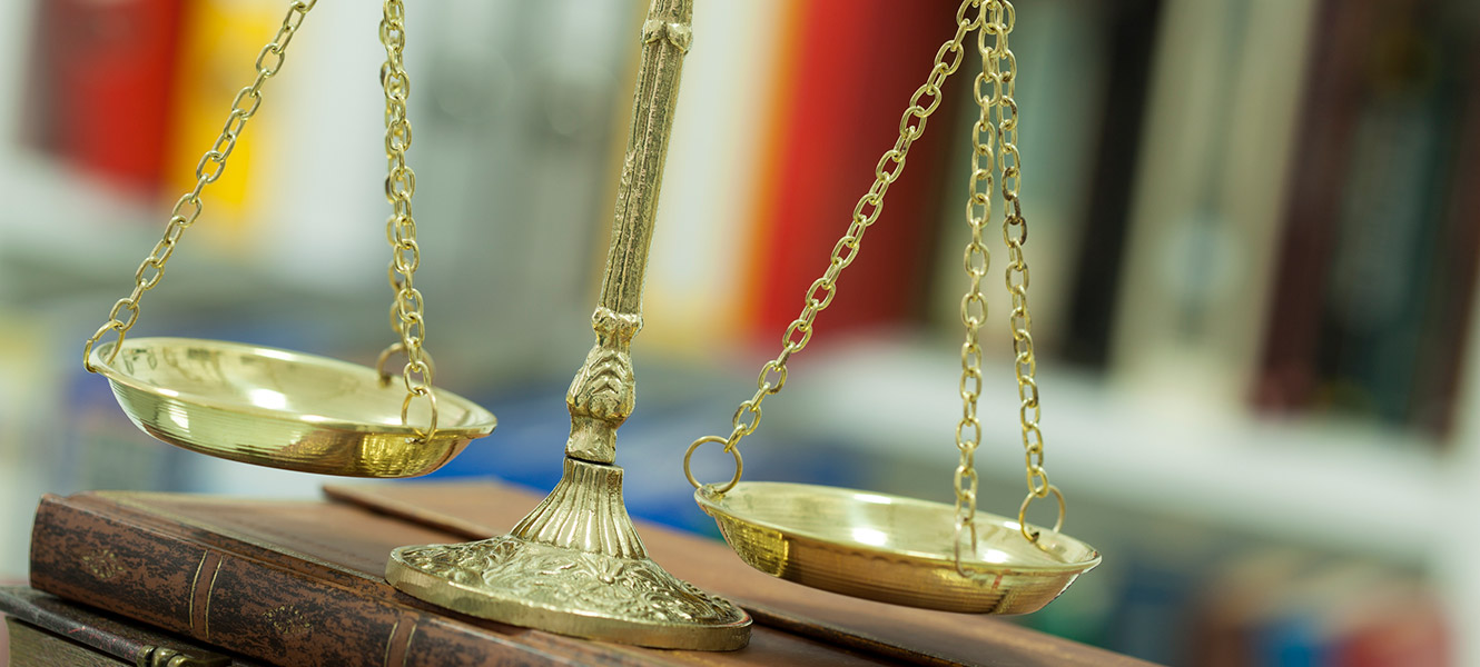 old fashioned gold scale on a book