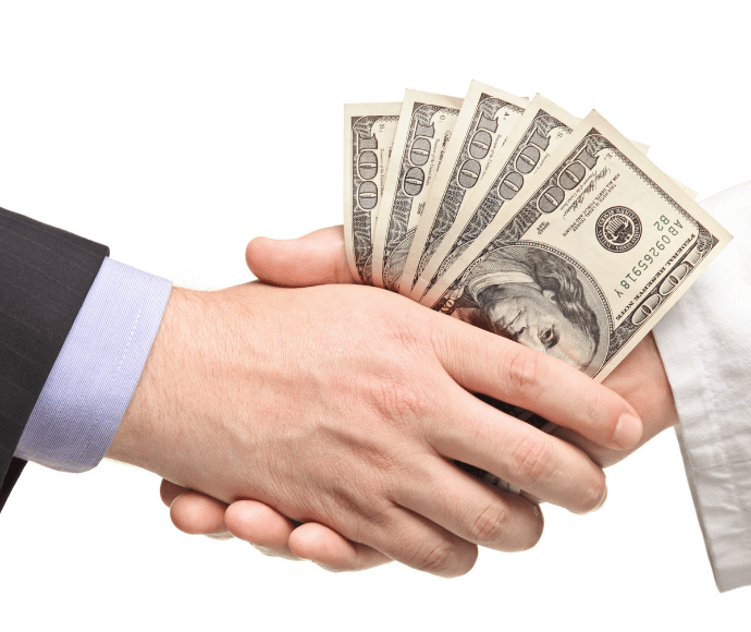 Money being handed from one person to another