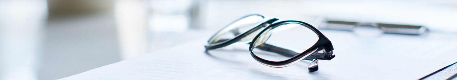 glasses on documents