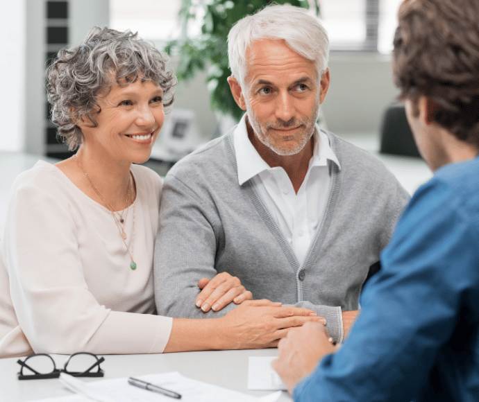 Older couple talking to banker