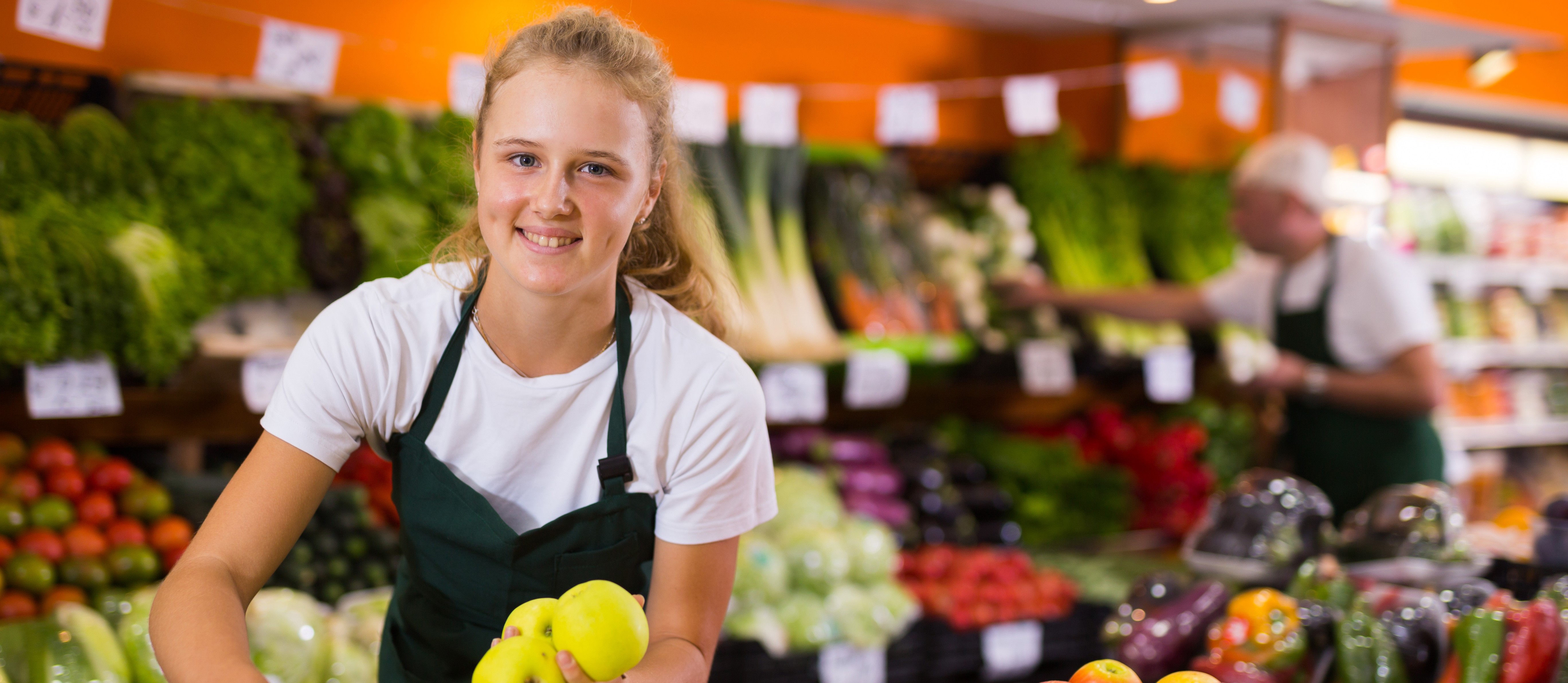 teen girl working at grocery store